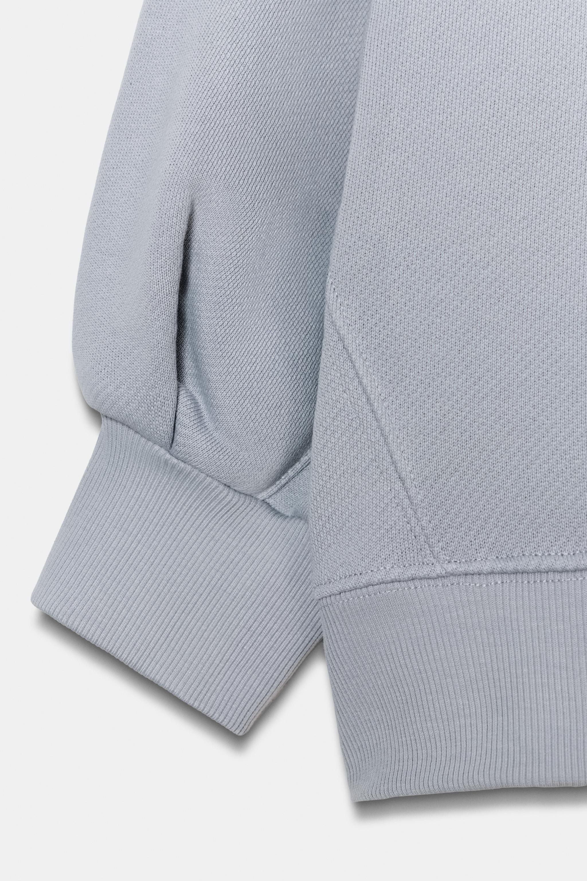 VOLUME CROPPED SWEATSHIRT